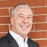 A headshot of Adrian Swinscoe