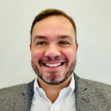 A headshot of Andy Traba