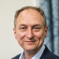 A headshot of Christopher Brooks