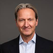 A headshot of David Schmaier