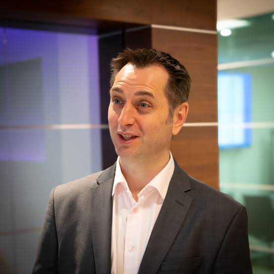 A headshot of Justin Hamilton Martin