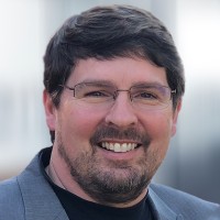 A headshot of Mark Smith