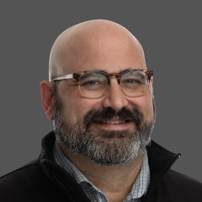 A headshot of Martin Schneider