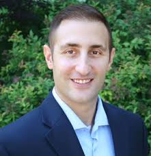 A headshot of Omer Minkara