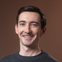 A headshot of Scott White