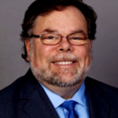 A headshot of Stephen Sattler